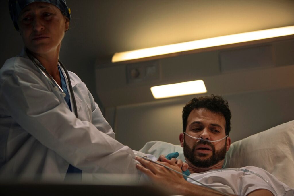 Doctor examining a patient during an urgent care visit.