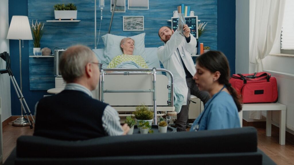 A Lady With Doctors Checking A Patient