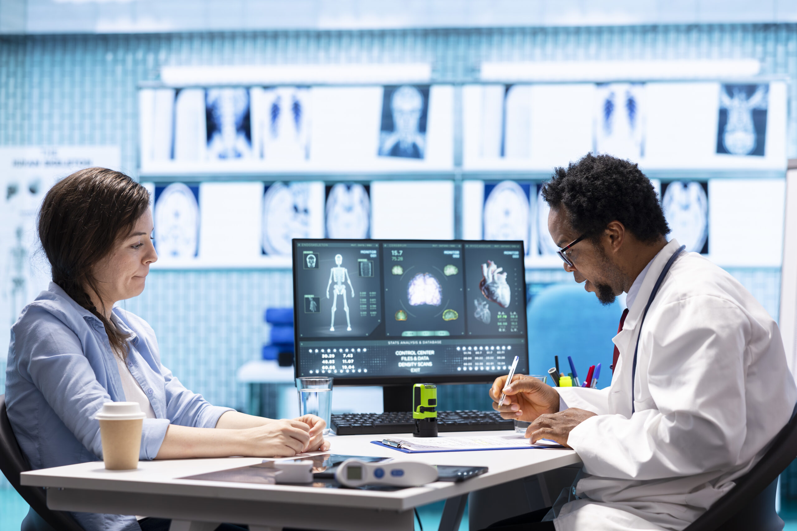 Doctor reviewing AI-enhanced ultrasound images on digital screen in modern medical clinic