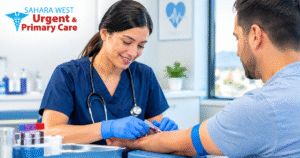 Healthcare professional collecting a blood sample from a patient for preventive health screening at Sahara West Urgent & Primary Care.